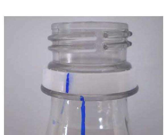 Removed cap with blue mark still visible on the neck